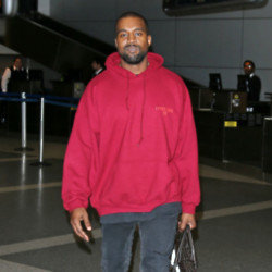 Kanye West makes dramatic catwalk debut at Paris Fashion Week