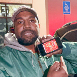 Kanye West is being hailed a ‘genius’ for filming his bizarre Super Bowl commercial with his mobile phone in the back of car