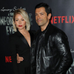 Kelly Ripa says Mark Consuelos is too buff for his clothes
