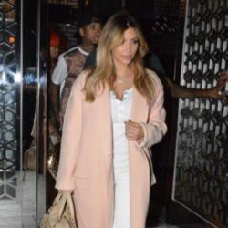 Kim Kardashian steps out in the must have pink coat