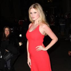 Lara Stone shows off her growing baby bump