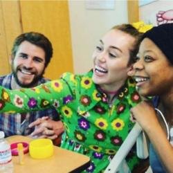 Liam Hemsworth, Miley Cyrus, and a fan via Instagram