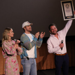 Logan Holladay was presented with his Guinness World Record by The Fall Guy stars Emily Blunt and Ryan Gosling