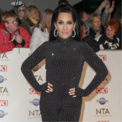 Michelle Visage had to have her breast implants removed