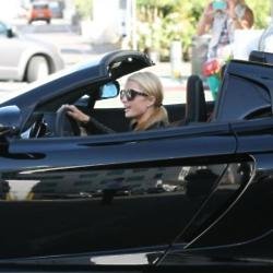 Paris Hilton leaving dealership in car