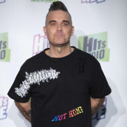 Robbie Williams would say yes to playing Glastonbury's legends slot