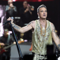 Robbie Williams is helping to boost his pal's music career