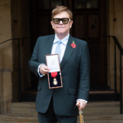 Sir Elton John receiving his Companion of Honour