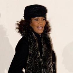 A Whitney Houston fan was thrown out of a musical for singing too loudly.