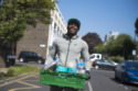 Dizzee Rascal helps distribute food parcels in community where he grew up