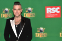 Robbie Williams reveals his father has been diagnosed with Parkinson’s disease