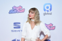 Taylor Swift raises a glass as fans speculate new music is imminent