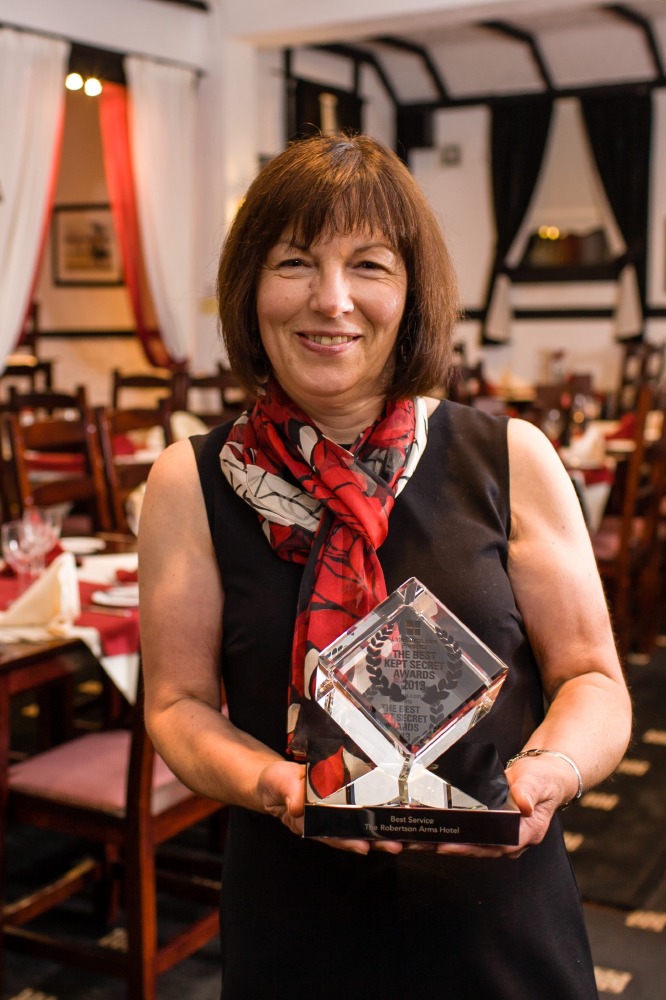 Owner of The Robertson Arms with her award
