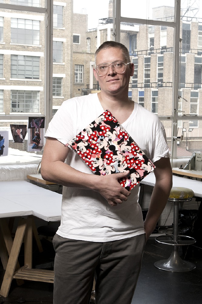 Giles Deacon poses with his Minnie Sky box