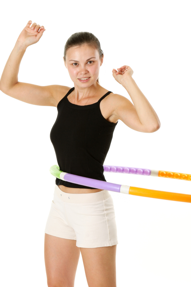 Use a hula hoop to tone your mid-section