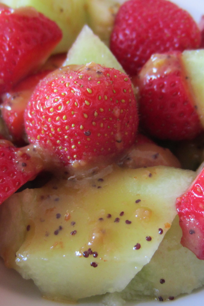 Strawberries and melon with poppy seed dressing