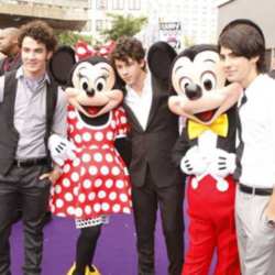 The Jonas Brothers with Minnie and Mickey at the premiere