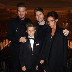 Christopher Bailey with David, Victoria and Romeo Beckham