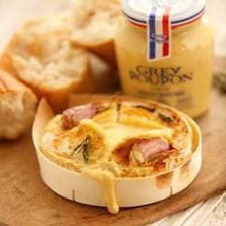 Baked French camembert in a box with mustard and Garlic oil