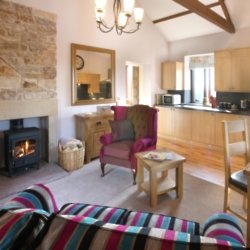 The living room, dining and kitchen area of Oak Cottage