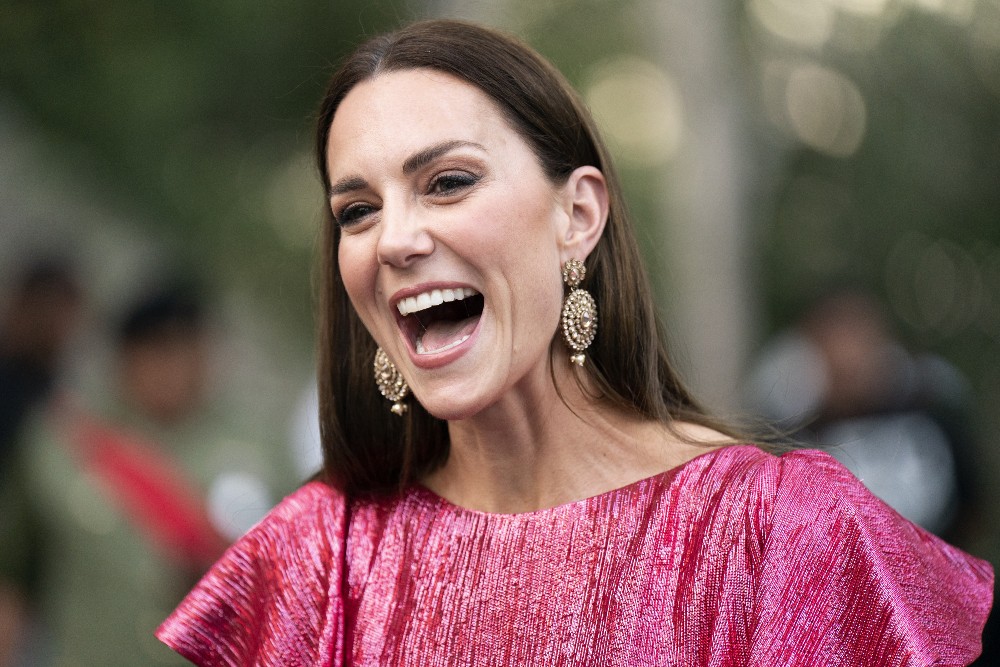 Kate smiles at the event whilst talking to guests, obviously impressed by something she's heard, whilst stunning in her pink dress. / Picture Credit: Jane Barlow/PA Wire/PA Images