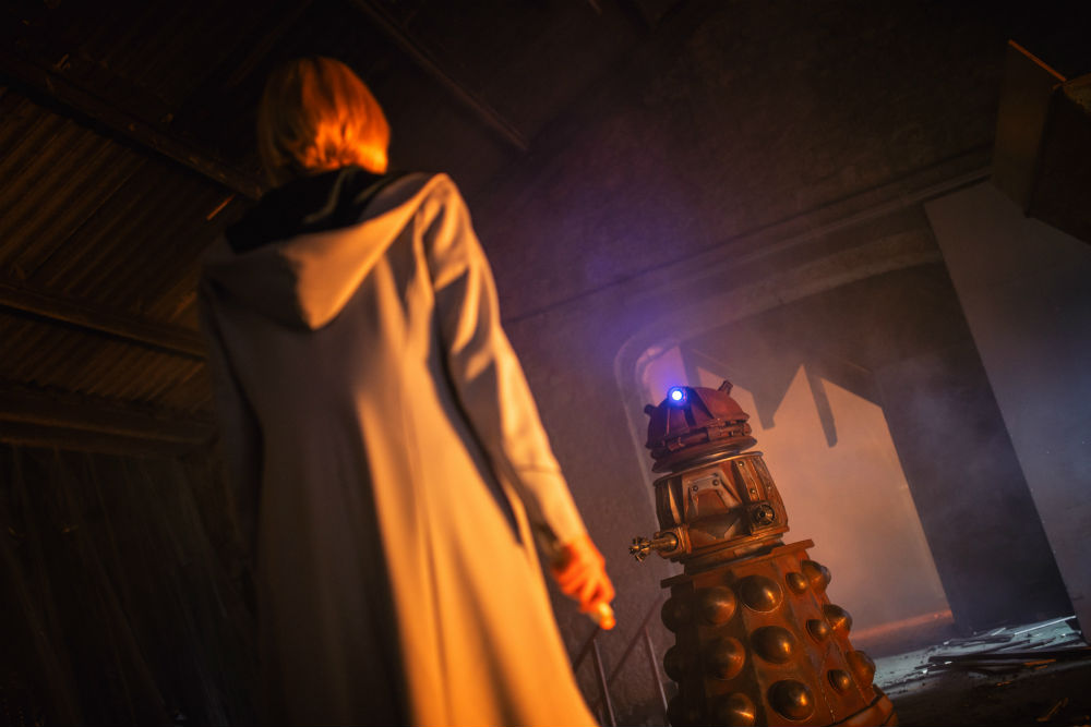 Jodie Whittaker as The Doctor, facing off against a Dalek in Doctor Who / Photo Credit: BBC/James Pardon