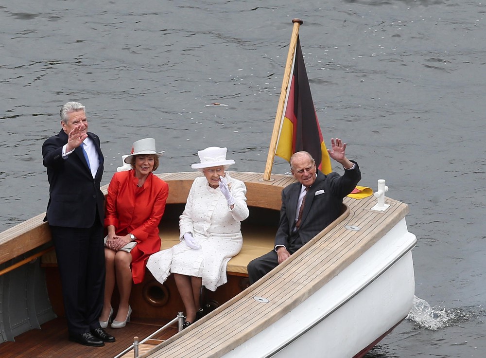Queen Elizabeth II with late husband Prince Philip on a visit to Berlin, Germany in June 2015. She rides the boat here alongside the country's President. / Picture Credit: Wolfgang Kumm/dpa/Alamy Live News