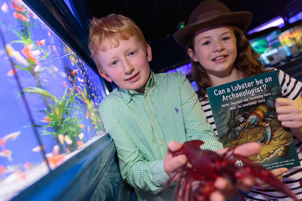 David Laing (10) and Daisy Nicholls (10) of Aberdeen launch the new book Can a Lobster be an Archaeologist?