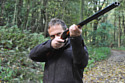 Declan heads deeper into the woods with a shotgun / Credit: ITV