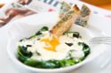 Baked Eggs with Black Garlic and Buttered Soldiers