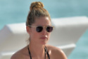 Model Doutzen Kroes goes make-up free while relaxing on a Miami beach