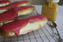 Lemon Curd Éclairs With Raspberry Icing