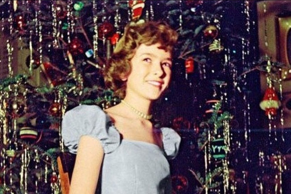 14-year-old Martha Stewart poses in front of the Christmas tree