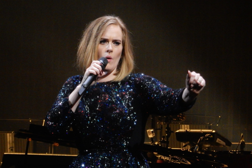 Adele pokes fun at exes on UK TV special