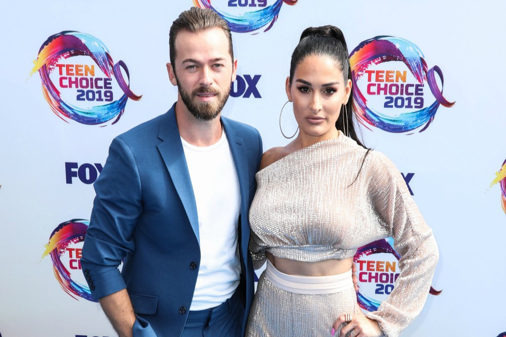 Artem Chigvintsev and Nikki Bella at the Teen Choice Awards