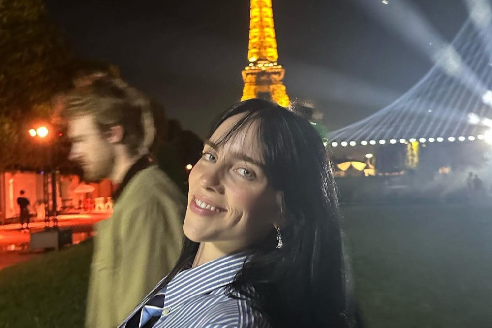 Billie Eilish is after a kiss during Paris Fashion Week