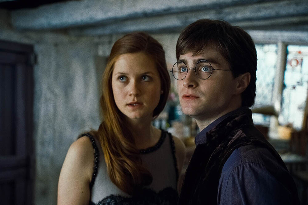 Bonnie Wright as Ginny Weasley with Daniel Radcliffe as Harry Potter