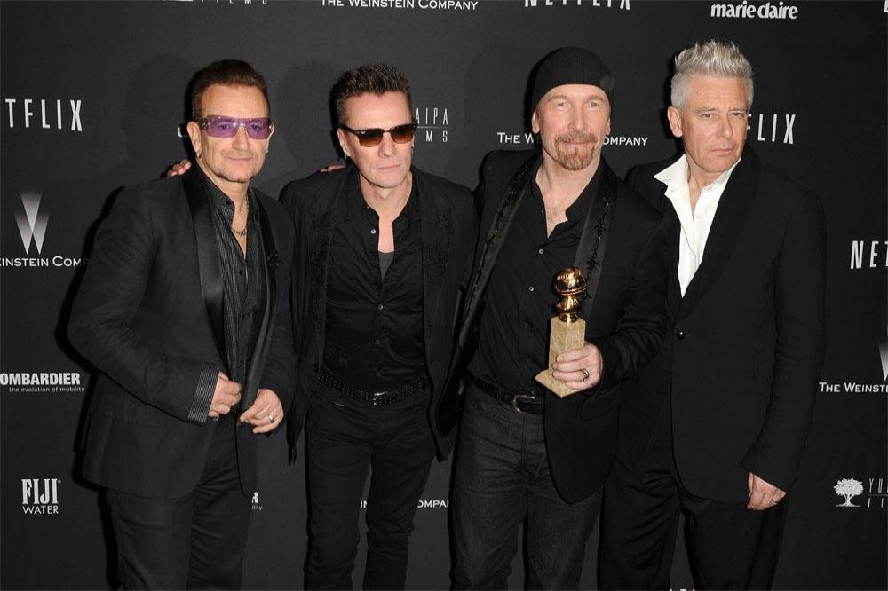 Bono with bandmates