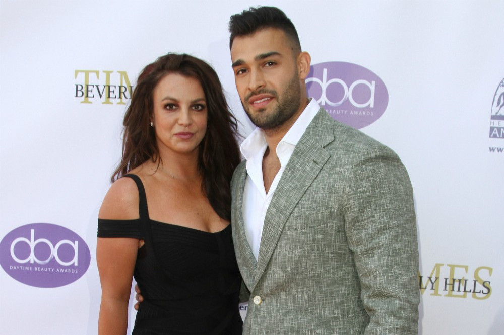 Britney Spears' fiance Sam Asghari says they are 'taking things positively' and are 'moving forward' after tragically losing their baby