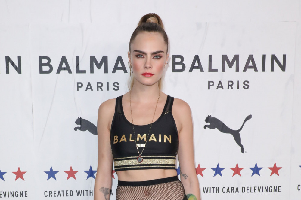 Cara Delevingne has heaped praise on Karl Lagerfeld