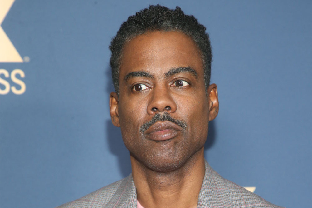 The brother of Chris Rock (pictured) wants to fight Will Smith in a boxing match