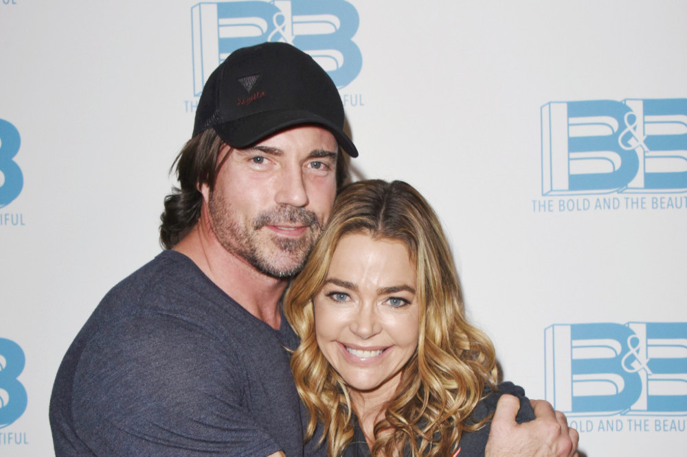 Denise Richards' husband Aaron Phypers helps her create saucy content.