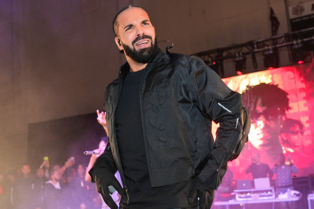 Drake stopped his gig on Sunday night after an ‘over-hyped’ fan fell from a balcony into a bunch of New York Giants players