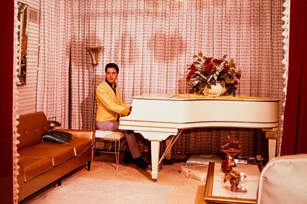 Elvis sat at his baby grand piano