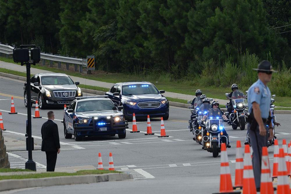 Family arrive at Bobbi Kristina Brown's funeral escorted by police