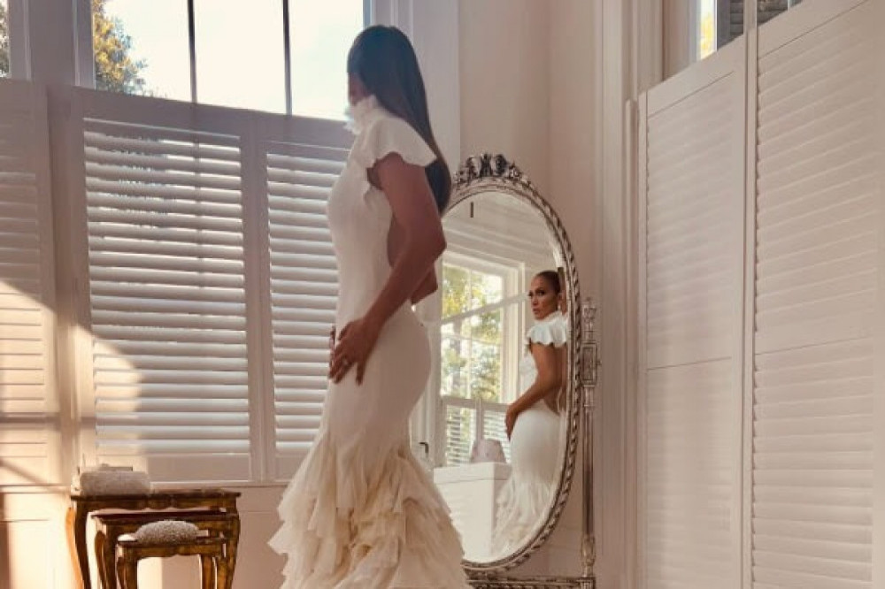 J. LO shares the first look at her wedding dress (C) Jennifer Lopez/OnTheJLo
