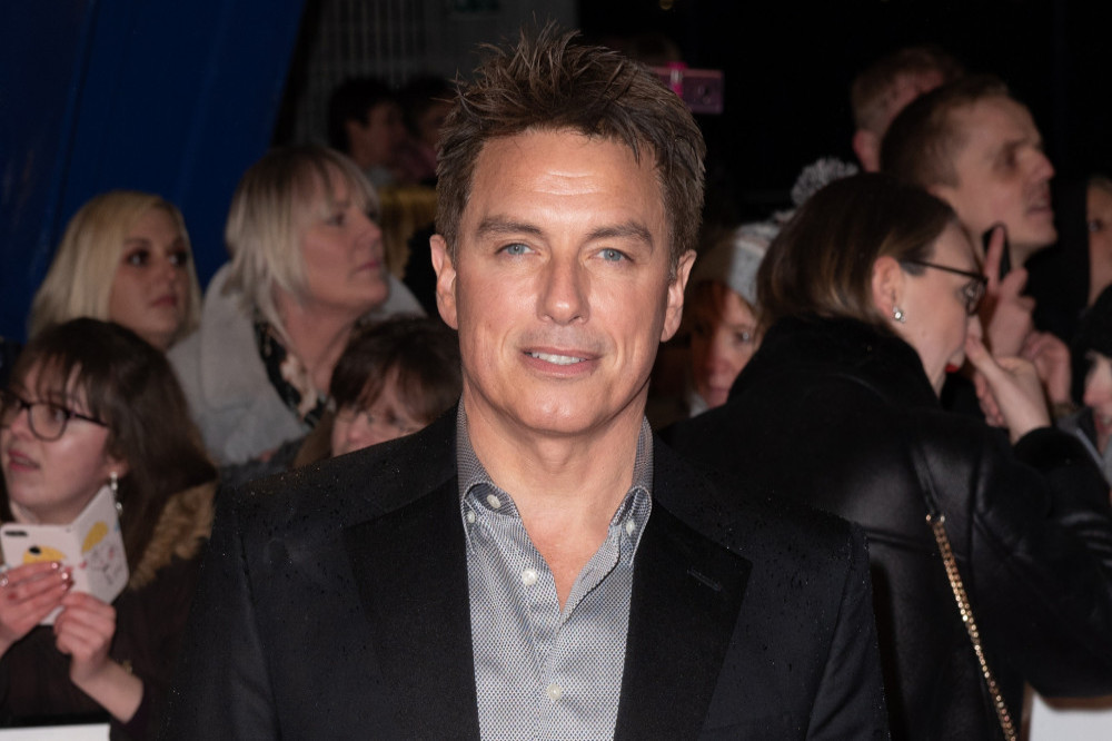 John Barrowman's dog Harris is recovering from surgery this week