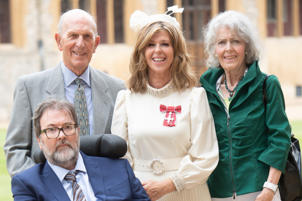 Kate Garraway with her parents and husband Derek Draper at her MBE ceremony