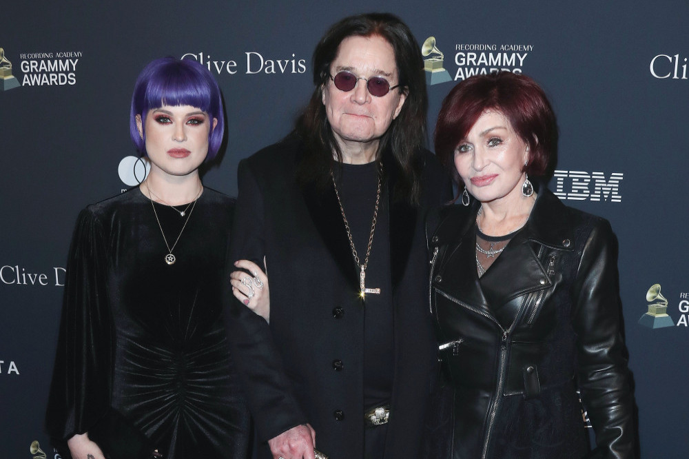 Kelly Osbourne with her parents Ozzy and Sharon Osbourne