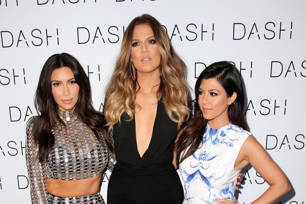 Khloé Kardashian with sisters Kim and Kourtney